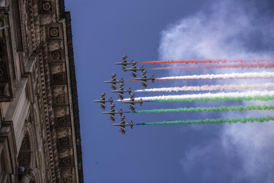 The Frecce Tricolori aerobatic squad of the Italian Air Force flies over Milan, northern Italy, Monday, May 25, 2020 on the occasion of the 74th anniversary of the founding of the Italian Republic on June 2, 1946. This year the acrobatic squad will fly over several Italian cities to bring a message of unity and solidarity during the coronavirus pandemic.(AP Photo/Luca Bruno)