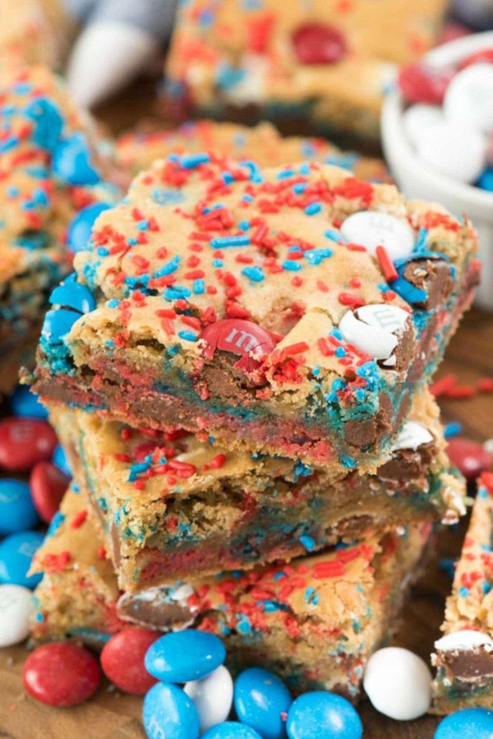 fireworks blondies packed with red, white, and blue m and m's and sprinkles for 4th of july
