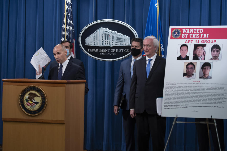 Acting U.S. Attorney for the District of Columbia Michael R. Sherwin speaks, Wednesday, Sept. 16, 2020 at the Justice Department in Washington. The Justice Department has charged five Chinese citizens with hacks targeting more than 100 companies and institutions in the United States and abroad, including social media and video game companies as well as universities and telecommunications providers. Officials announced the prosecution on Wednesday. (Tasos Katopodis/Pool via AP)