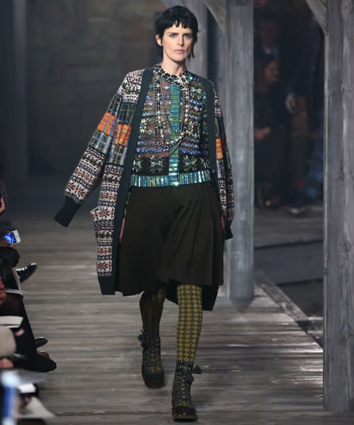 Stella Tennant modelled an embellished Shetland wool jumper, tartan trimmed coat and long black lace skirt.