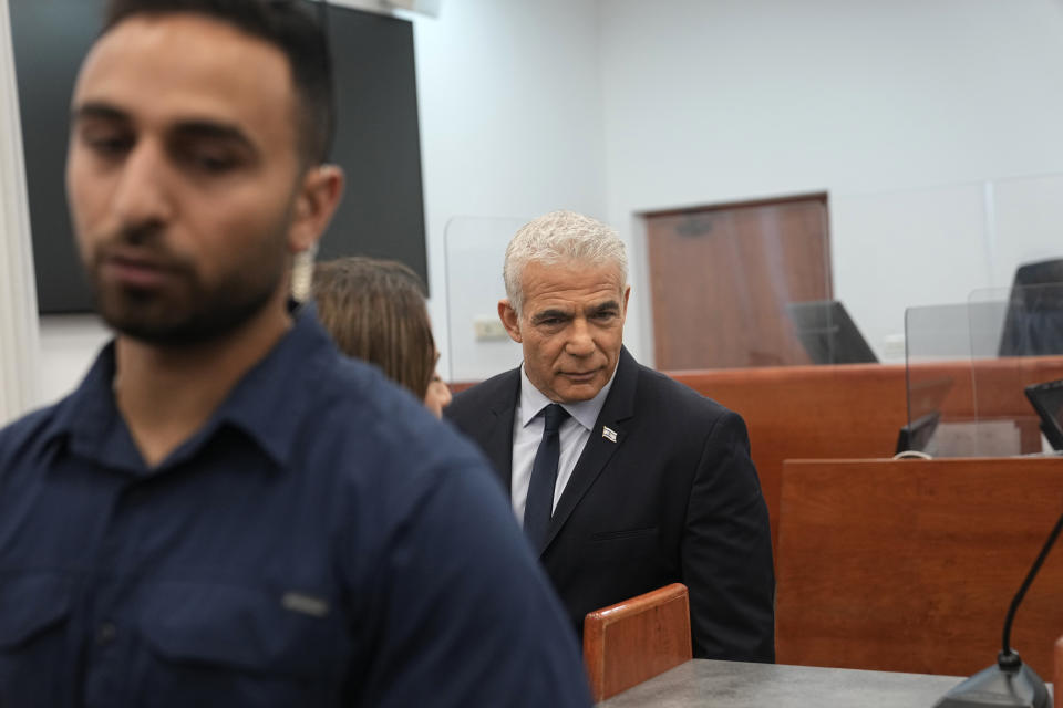 Israeli opposition leader Yair Lapid prepares to testify at the trial of Prime Minister Benjamin Netanyahu on corruption charges at the Jerusalem District Court, in east Jerusalem, Monday, June 12, 2023. (AP Photo/Ohad Zwigenberg)