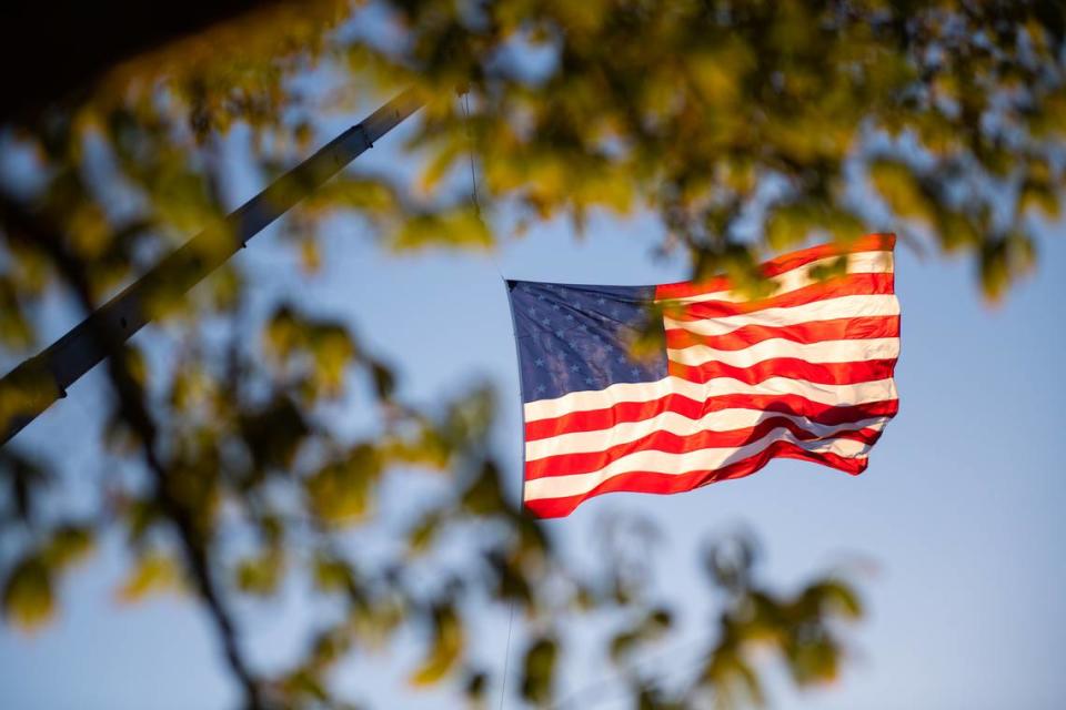 The American flag flies above Fourth of July festivities at Barney Schwartz Park in Paso Robles, on July 4, 2023.