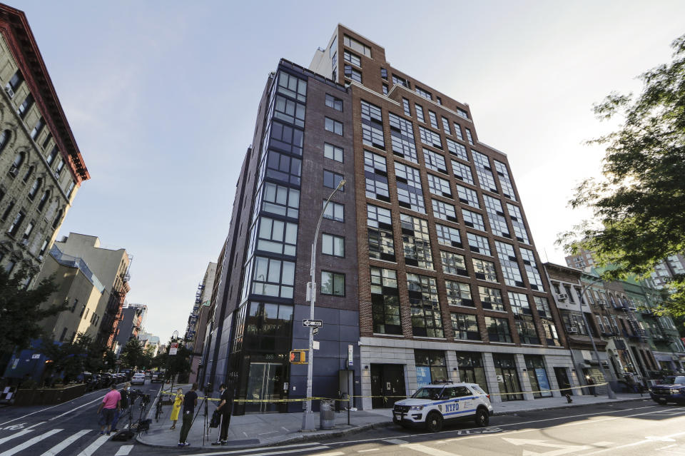 A New York Police cruiser is parked at 265 East Houston Street Wednesday, July 15, 2020, in New York. Police say the dismembered body of a 33-year-old tech entrepreneur has been found inside his luxury Manhattan condo. Fahim Saleh was found at around 3:30 p.m. Tuesday inside his apartment on the Lower East Side. (AP Photo/Frank Franklin II)