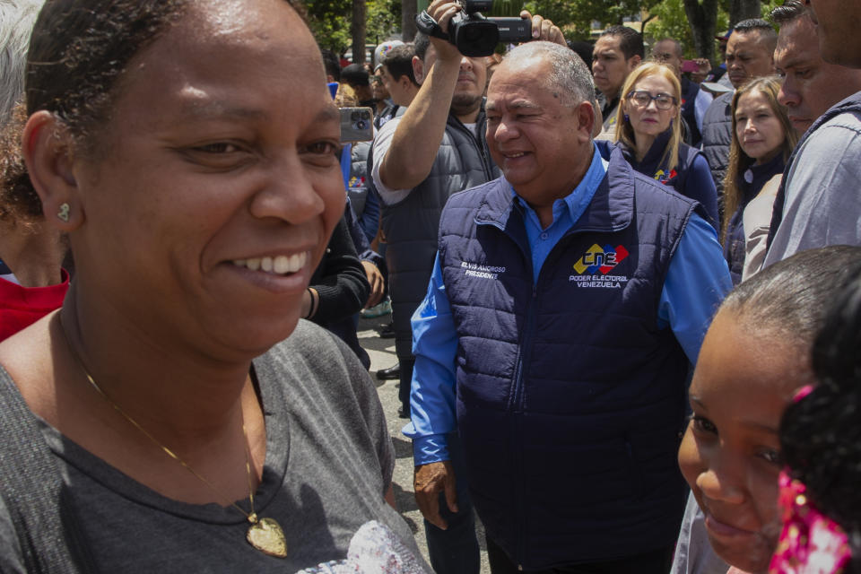 National Electoral Council President Elvis Amoroso, center, smiles after taking part in a rehearsal for the July 28 presidential election, in Caracas, Venezuela, Sunday, June 30, 2024. (AP Photo/Cristian Hernandez Fortune)