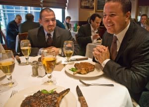 Business lunch with smiling businessmen