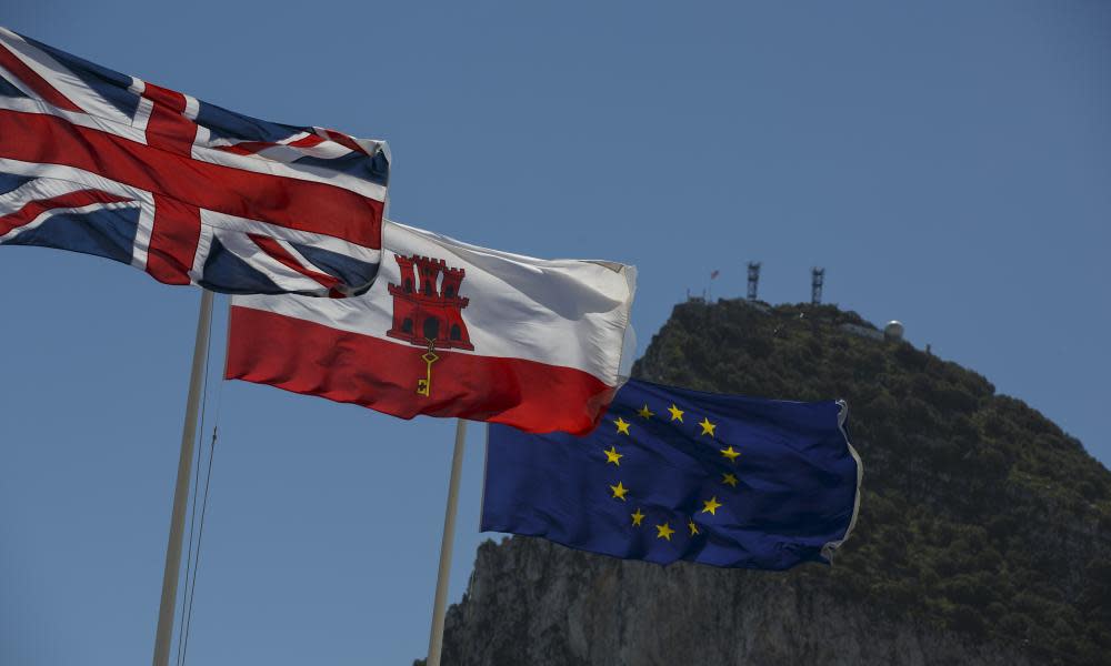 Flags of the United Kingdom, Gibraltar and the European Union are flown with Gibraltar in the background
