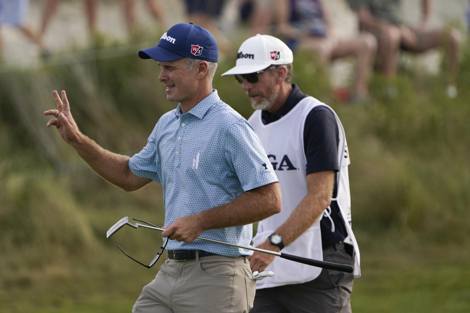 Kevin Streelman waves after a birdie on the 16th green during the third round at the PGA Championship golf tournament on the Ocean Course, Saturday, May 22, 2021, in Kiawah Island, S.C. (AP Photo/Chris Carlson)