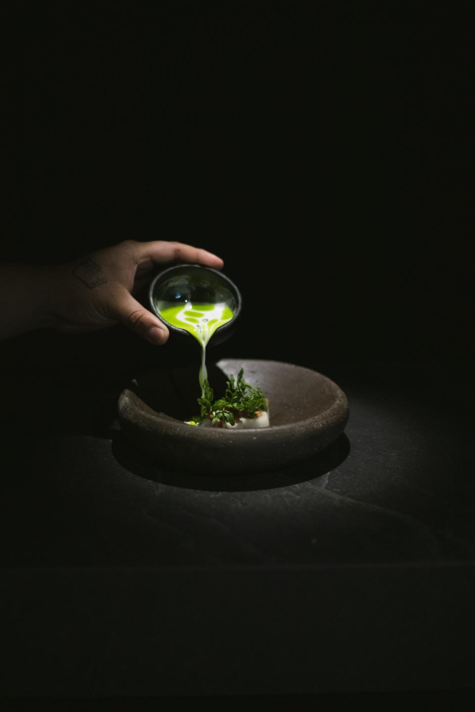 A dish of perulero, foie gras, macadamia milk, and epazote at Ana Cocina Local in Guatemala City