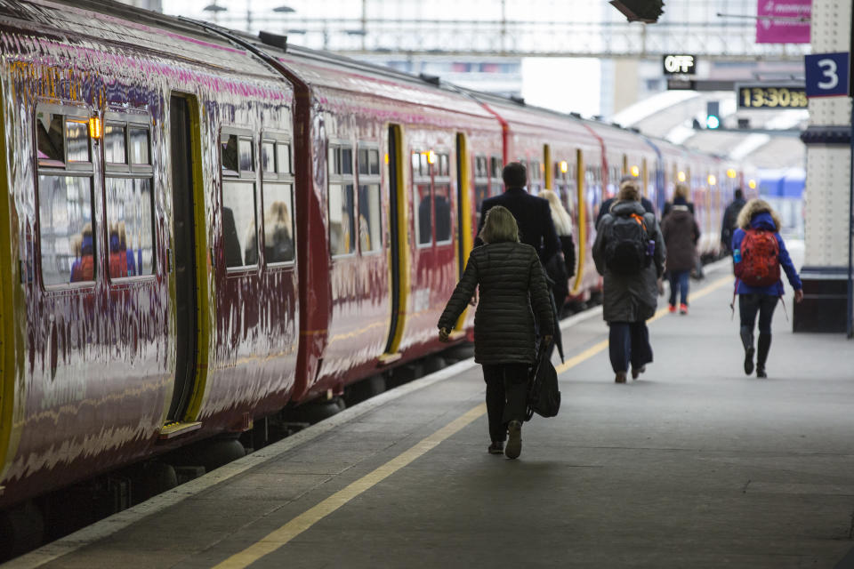 Train on platform with departure passengers