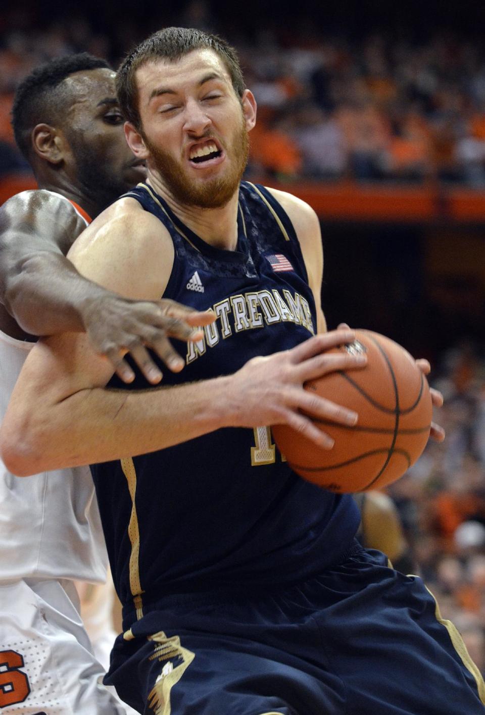 Notre Dame's Garrick Sherman drives against Syracuse's Rakeem Christmas during the first half of an NCAA college basketball game in Syracuse, N.Y., Monday, Feb. 3, 2014. (AP Photo/Kevin Rivoli)