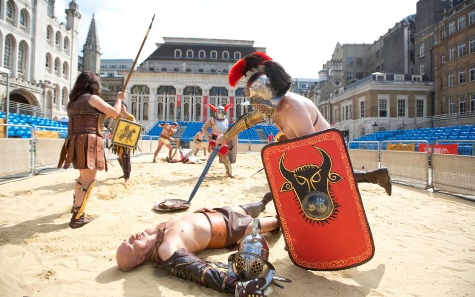 Actors re-enact London's gladiatorial games in the courtyard of the City of London's Guildhall - Heathcliff O'Malley 