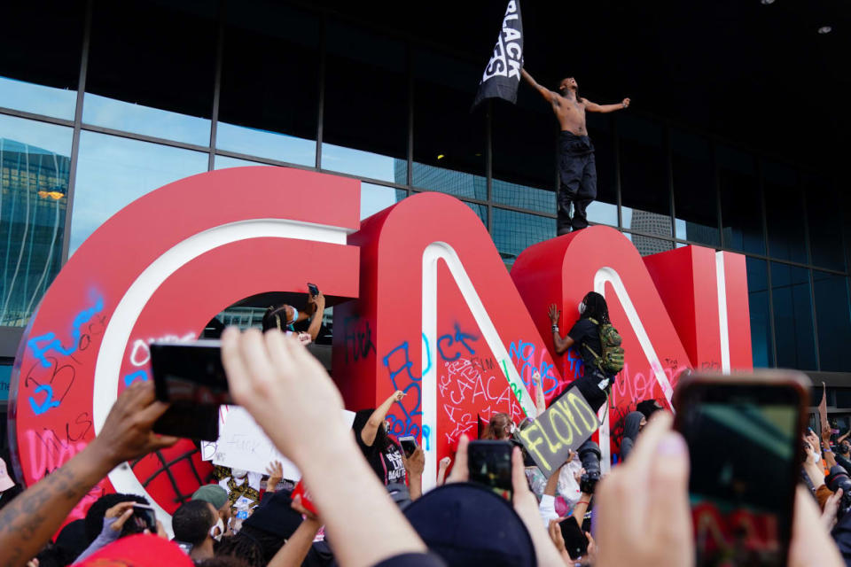 <div class="inline-image__caption"><p>People protested outside the CNN Center on May 29, 2020 in Atlanta, Georgia. Demonstrations erupted across the U.S. after George Floyd died in police custody on May 25th in Minneapolis, Minnesota.</p></div> <div class="inline-image__credit">Elijah Nouvelage/Getty</div>