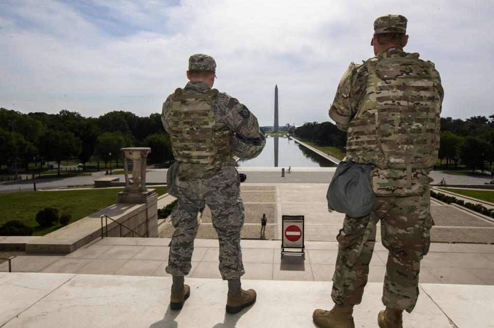 Members of the District of Columbia Army National Guard stand guard at the Lincoln Memorial in Washington, Wednesday, June 3, 2020, securing the area as protests continue following the death of George Floyd, a who died after being restrained by Minneapolis police officers. (AP Photo/Manuel Balce Ceneta)