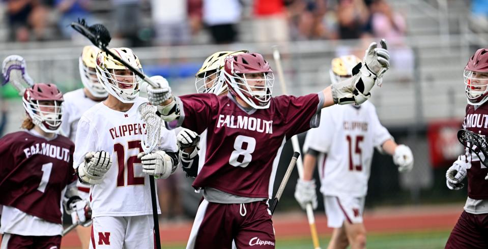 WALPOLE   06/14/23   Jackson Falcone of Falmouth (8) is joined by Cole Gaudet (right) and Oliver Partridge to celebrate after scoring to put them up 9-6 over Newburyport in the Div. 3 semifinal lacrosse match.