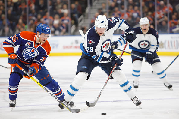 EDMONTON, AB - DECEMBER 11: Drake Caggiula #36 of the Edmonton Oilers harasses Patrik Laine #29 of the Winnipeg Jets on December 11, 2016 at Rogers Place in Edmonton, Alberta, Canada. (Photo by Codie McLachlan/Getty Images)