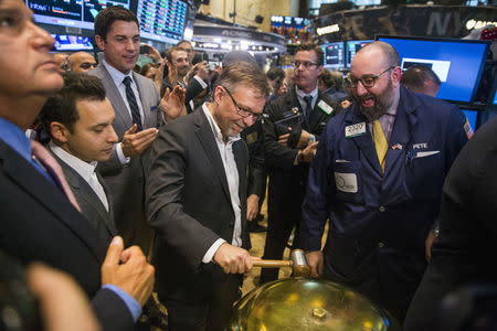 Shopify Chief Financial Officer Russ Jones rings a ceremonial bell to mark the company's IPO on the floor of the New York Stock Exchange May 21, 2015. REUTERS/Lucas Jackson