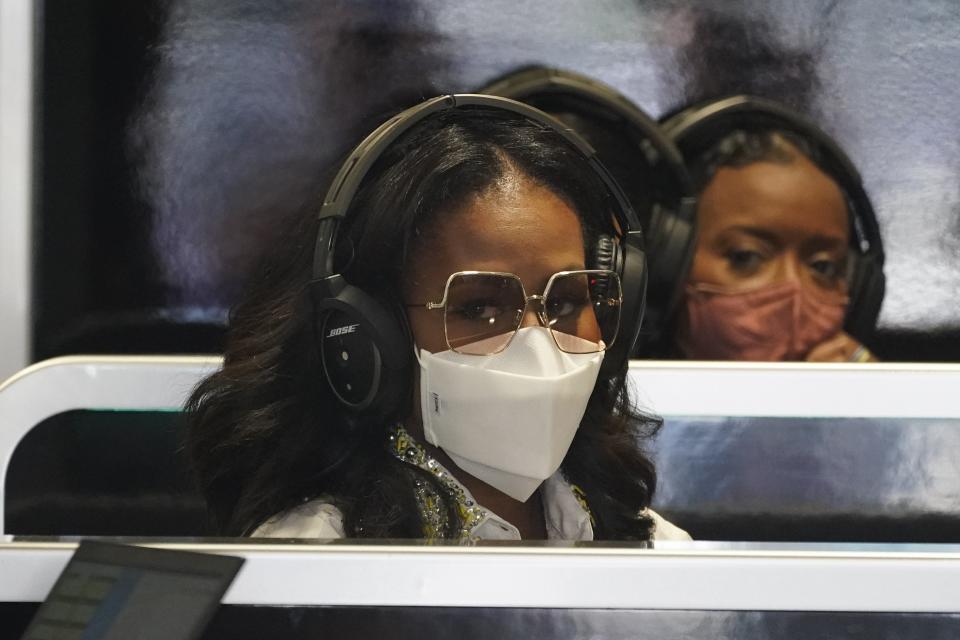 Former first lady Michelle Obama sits in the Mercedes team garage Saturday before the third practice session for the Formula 1 Miami Grand Prix at the Miami International Autodrome in Miami Gardens.