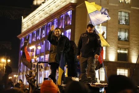 Ukrainian opposition figure and Georgian former President Mikheil Saakashvili (L) waves to supporters after he was released from detention in Kiev, Ukraine December 11, 2017. REUTERS/Gleb Garanich