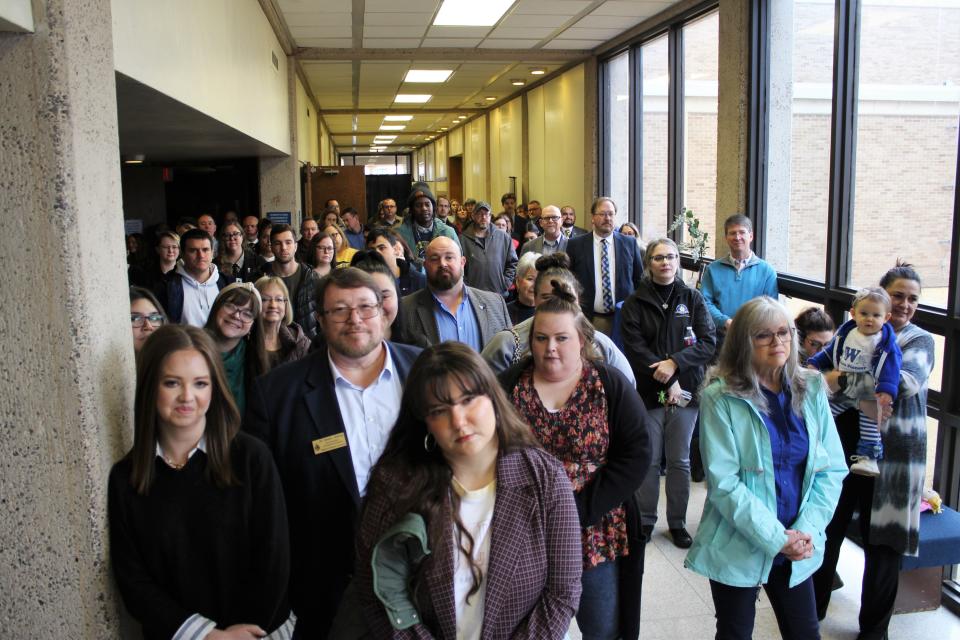 Wayland Baptist University students, faculty and staff listen to President Bobby Hall speak at a reception for Wayland President-Elect Donna Hedgepath Friday in Plainview.