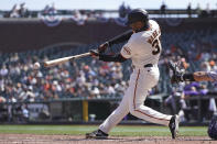 San Francisco Giants' LaMonte Wade Jr. hits a double against the Colorado Rockies during the fifth inning of a baseball game in San Francisco, Sunday, April 11, 2021. (AP Photo/Jeff Chiu)