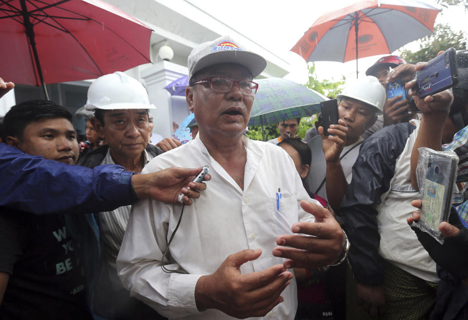 Mya Thein, father of rape suspect Aung Kyaw Myo, talks to journalists after the trial of her son at a court Wednesday, July 24, 2019, in Nyapyitaw, Myanmar. A Myanmar court held another hearing related to the rape of a 2-year old girl at her nursery school, in a case that generated huge interest and protests. (AP Photo/Aung Shine Oo)