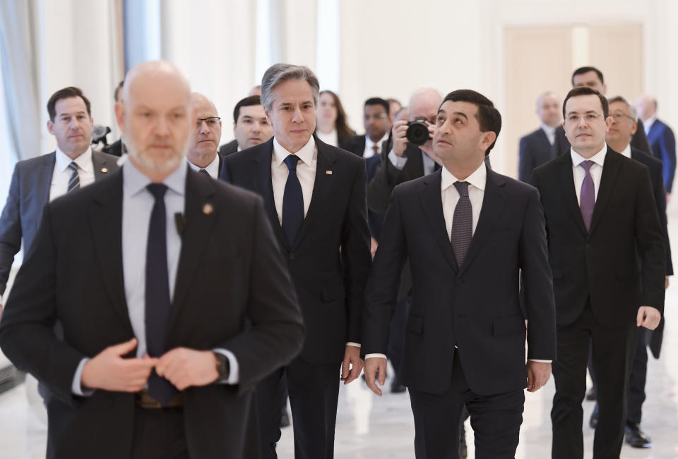 U.S. Secretary of State Antony Blinken, center left, and Uzbekistan Acting Foreign Minister Bakhtiyor Saidov walk to a meeting at the National Library in Tashkent, Uzbekistan, Wednesday, March 1, 2023. (Olivier Douliery/Pool Photo via AP)