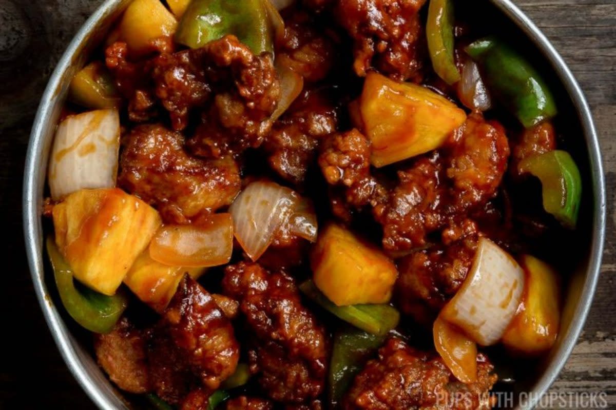 <p>Pups with Chopsticks</p><p>A traditional Chinese sweet and sour pork recipe (Cantonese Style) made with crispy pork, pineapple, peppers and onions tossed in a sticky sweet and sour sauce!</p><p><strong>Get the recipe: <a href="https://pupswithchopsticks.com/sweet-and-sour-pork/" rel="nofollow noopener" target="_blank" data-ylk="slk:Chinese Sweet and Sour Pork;elm:context_link;itc:0;sec:content-canvas" class="link rapid-noclick-resp">Chinese Sweet and Sour Pork</a></strong></p>