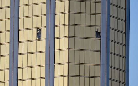 Broken windows on the 32nd floor of the Mandalay Bay hotel - Credit: David Becker/Getty