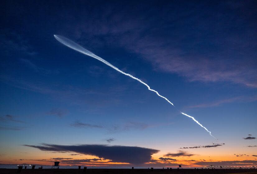 Huntington Beach, CA - March 18: The launch of SpaceX Falcon 9 rocket with 22 Starlink satellites is viewed from Huntington Beach at dusk after taking off from Vandenberg Space Force Base Monday, March 18, 2024. (Allen J. Schaben / Los Angeles Times)