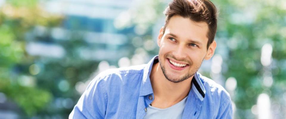 handsome young man with a big smile, candid shot