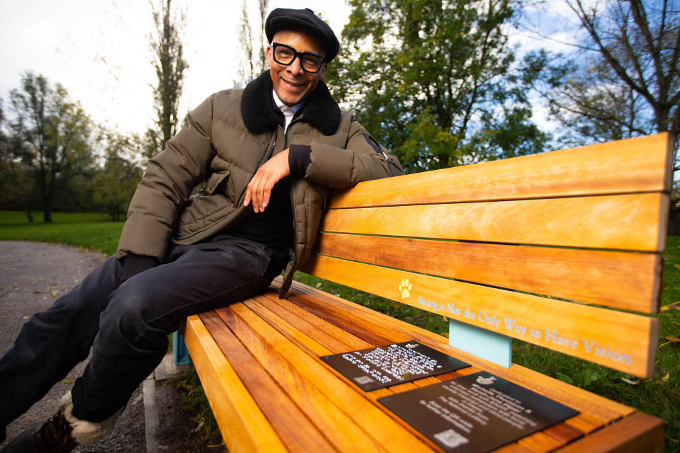 EDITORIAL USE ONLY Jay Blades as he prepares to present a personally designed bench to Michelle Thomson and Sarah-Jane Piper, created for them by The National Lottery to celebrate their work with The Blind and Sight Impaired Society during the COVID-19 pandemic, at Gloucester Park, Essex.