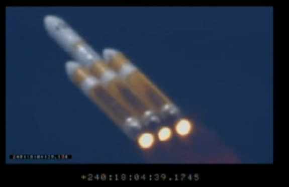This screengrab from a launch webcast shows America's secret NROL-65 spy satellite heading toward space on Aug. 28, 2013, borne aloft by a Delta 4 Heavy rocket.