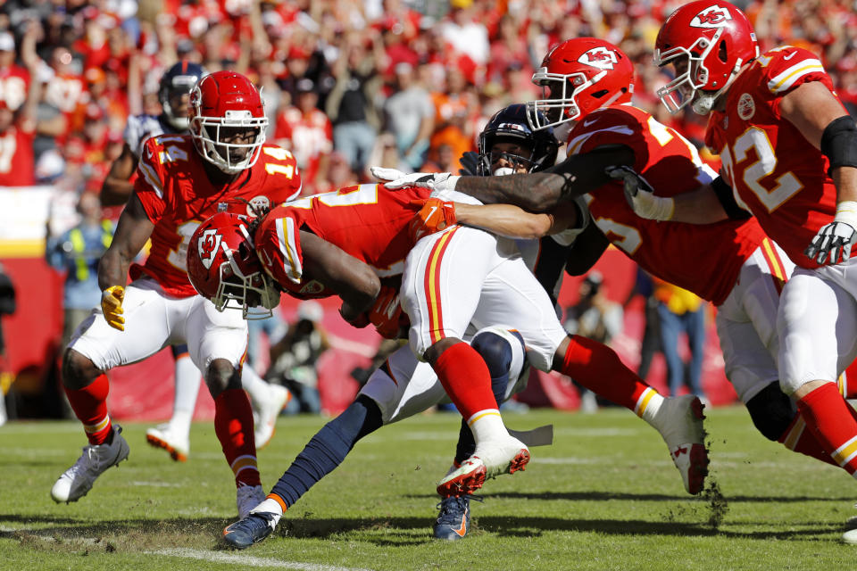 Kansas City Chiefs running back Kareem Hunt (27) crosses into the end zone for a touchdown during the second half of an NFL football game against the Denver Broncos in Kansas City, Mo., Sunday, Oct. 28, 2018. (AP Photo/Charlie Riedel)