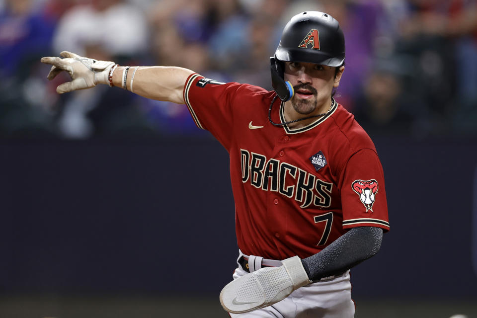 ARLINGTON, TEXAS - OCTOBER 27: Corbin Carroll #7 of the Arizona Diamondbacks celebrates after scoring a run in the third inning against the Texas Rangers during Game One of the World Series at Globe Life Field on October 27, 2023 in Arlington, Texas. (Photo by Carmen Mandato/Getty Images)