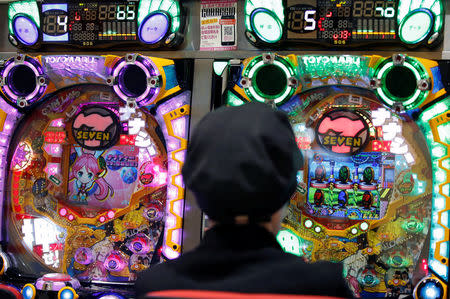 A visitor plays pachinko, a Japanese form of legal gambling, at a pachinko parlour in Fukushima, Japan, May 24, 2018. Picture taken May 24, 2018. REUTERS/Issei Kato