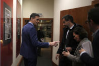 Spain's Prime Minister Pedro Sanchez leaves a press conference at the Moncloa Palace in Madrid, Spain, Sunday, Jan. 12, 2020. Sanchez was chosen by Parliament as prime minister on Tuesday, ending a period in which he led a caretaker Socialist government following two inconclusive elections last year. (AP Photo/Manu Fernandez)