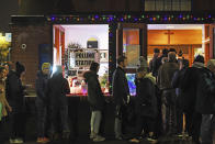 Voters queue outside St Andrews Church polling station in Balham, south London, just hours before voting closes for the 2019 General Election, Thursday, Dec. 12, 2019. Britons who have endured more than three years of wrangling over their country’s messy divorce from the European Union cast ballots Thursday in an election billed as a way out of the Brexit stalemate in this deeply divided nation. (Victoria Jones/PA via AP)