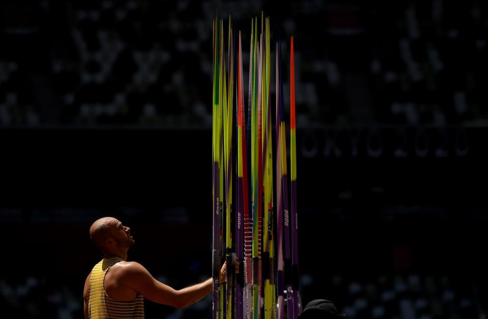 Germany's Julian Weber chooses his javelin during javelin qualifying.