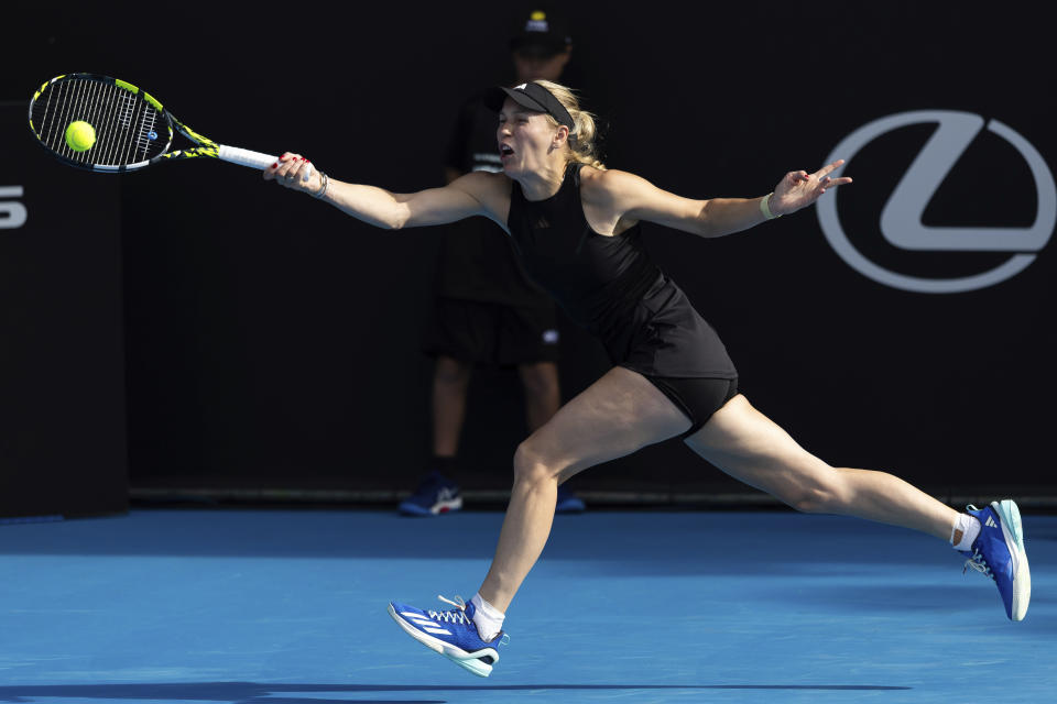 FILE - Caroline Wozniacki of Denmark plays against Elina Svitolina of Ukraine during her singles match at the ASB Classic tennis tournament in Auckland, New Zealand, on Jan. 2, 2024. The first 15-day Australian Open sets to start Sunday morning, Jan. 14, 2024. (Brett Phibbs/Photosport via AP, File)