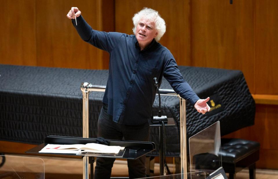Sir Simon Rattle rehearsing with the LSO (PA)