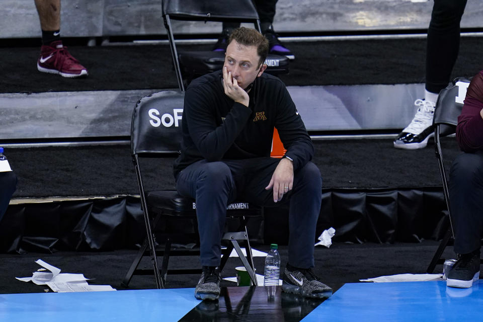 Minnesota head coach Richard Pitino on the bench in the second half of an NCAA college basketball game against Ohio State at the Big Ten Conference tournament in Indianapolis, Thursday, March 11, 2021. (AP Photo/Michael Conroy)