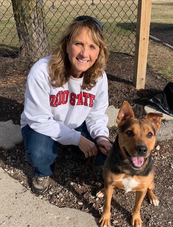 Tobi Neff of the Humane Society of Monroe County is pictured with Katie, a 3-year-old mixed shepherd with health issues. Last month, Katie was picked up by animal control as a stray.