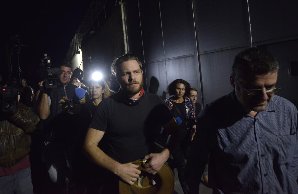 Jock Palfreeman leaves a migrants' detention centre in Busmantsi, Bulgaria, Tuesday, Oct. 15, 2019. Australian man Palfreeman was convicted of fatally stabbing a Bulgarian student during a 2007 brawl and has been paroled after serving 11-years of his 20-year prison sentence, but then held back in a detention centre after a prosecutors' petition to revoke the parole. (AP Photo)