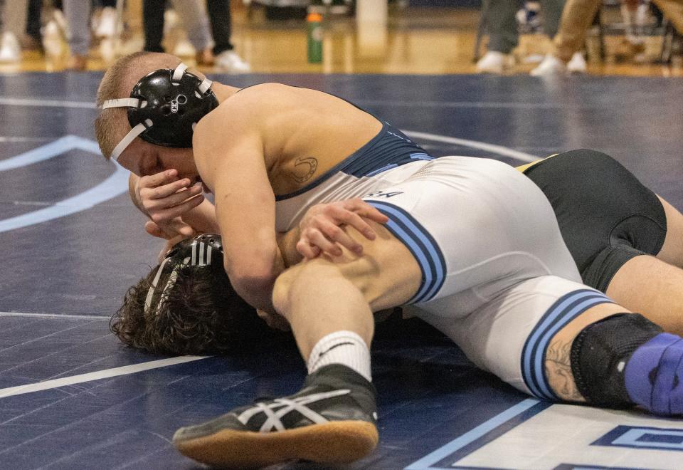 CBA's Alex Nini (top) pinned Southern's Noah Fontana in the 144-pound bout in the Colts' 30-28 win over the Rams Tuesday night.
