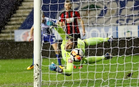 Callum Edler scores Wigan's third goal past Bournemouth goalkeeper Artur Boruc - Credit: ACTION IMAGES