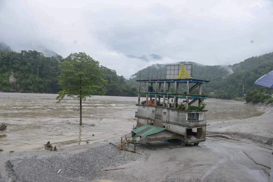 A building stands inundated after flash floods triggered by a sudden heavy rainfall swamped the Rangpo town in Sikkim, India, Thursday, Oct.5. 2023. The flooding took place along the Teesta River in the Lachen Valley of the north-eastern state, and was worsened when parts of a dam were washed away. (AP Photo/Prakash Adhikari)