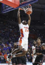 Florida guard Phlandrous Fleming Jr. (24) dunks against Troy during the first half of an NCAA college basketball game Sunday, Nov. 28, 2021, in Gainesville, Fla. (AP Photo/Matt Stamey)