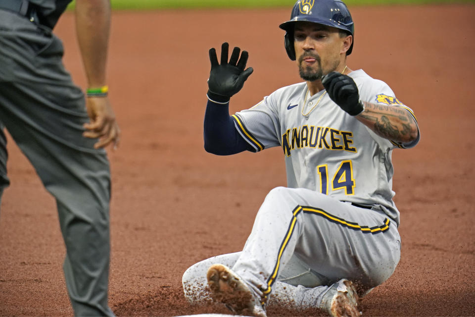 Milwaukee Brewers' Jace Peterson slides safely into third with an RBI triple off Pittsburgh Pirates starting pitcher Wil Crowe during the second inning of a baseball game in Pittsburgh, Thursday, July 1, 2021. (AP Photo/Gene J. Puskar)