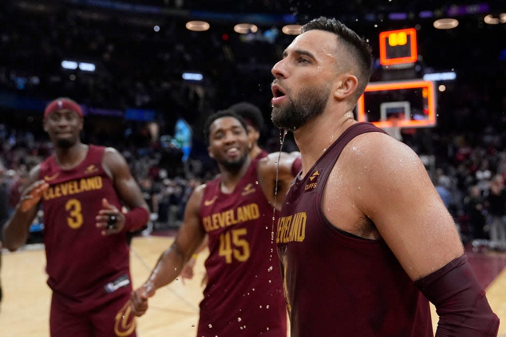 Cavaliers guard Max Strus, right is doused by teammates as they celebrate his game-winning basket against the Dallas Mavericks, Tuesday, Feb. 27, 2024, in Cleveland.