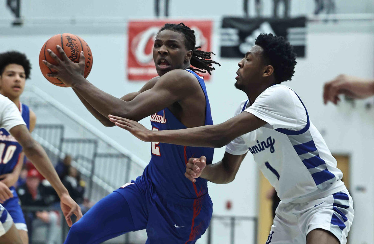 Woodward's Ru Mills (2) is The Enquirer's Division II boys basketball player of the year.